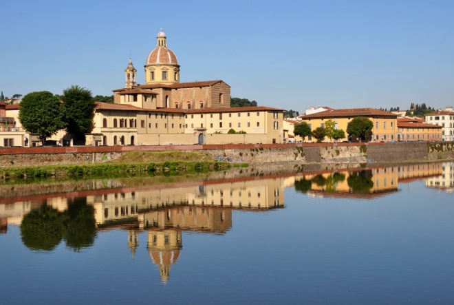 Perfect reflections on the still water, River Arno
